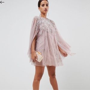 Mini dress with attached bejeweled cape